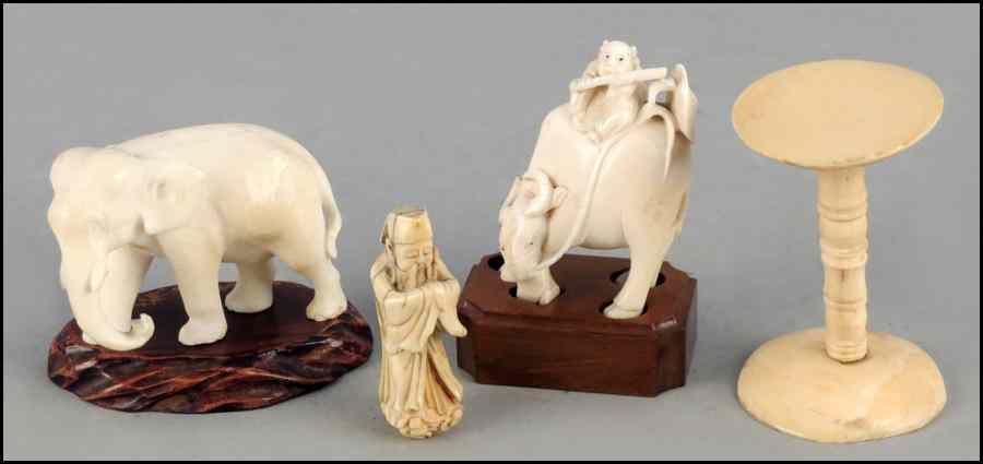 Appraisal: CARVED IVORY ELEPHANT Together with a carved ivory figure riding