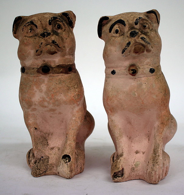 Appraisal: A PAIR OF FRENCH TERRACOTTA MONEY BOXES in the form