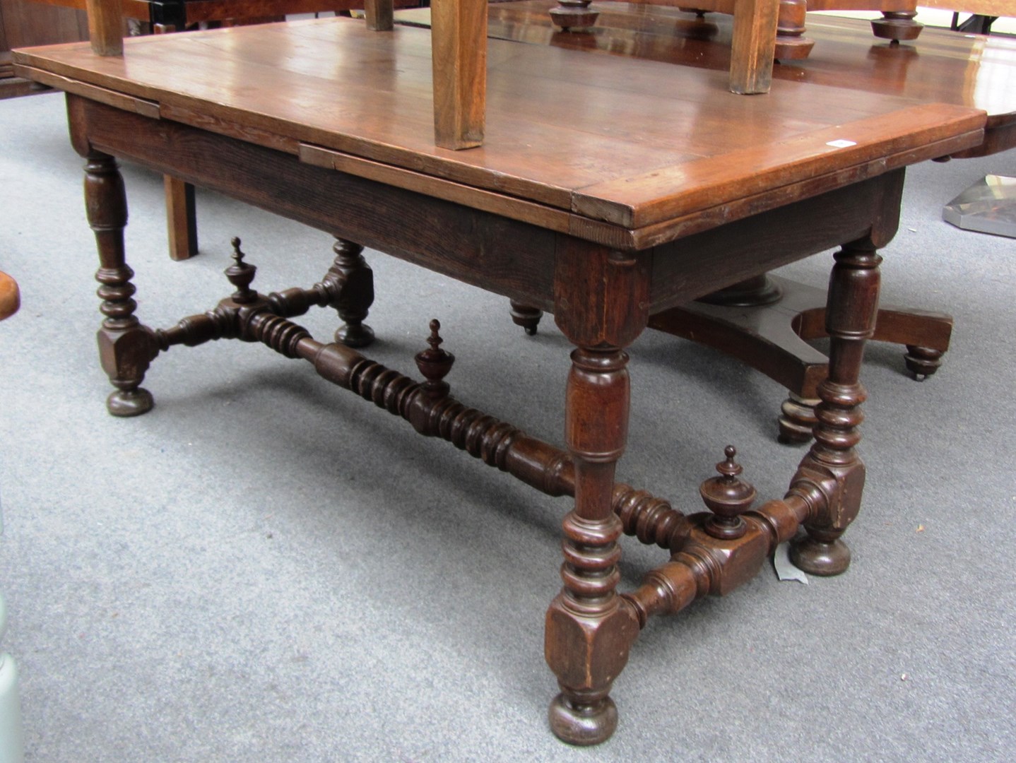 Appraisal: A th century French oak draw leaf dining table on