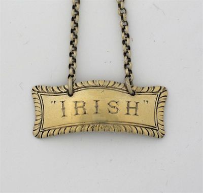 Appraisal: A Victorian silvergilt wine label gadrooned shaped oblong outline 'IRISH'