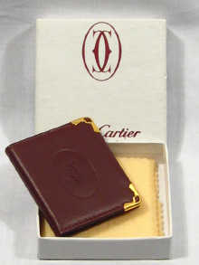 Appraisal: Cartier A Cartier leather and gilded metal travelling picture frame