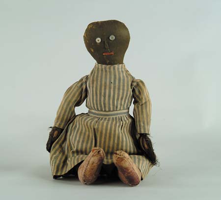 Appraisal: EARLY FOLK ART BLACK CLOTH DOLL th Century with what