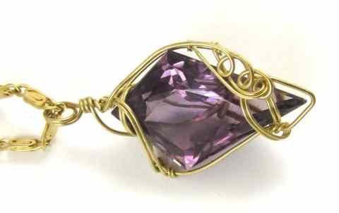 Appraisal: AMETHYST AND FOURTEEN KARAT GOLD PENDANT NECKLACE suspended on a