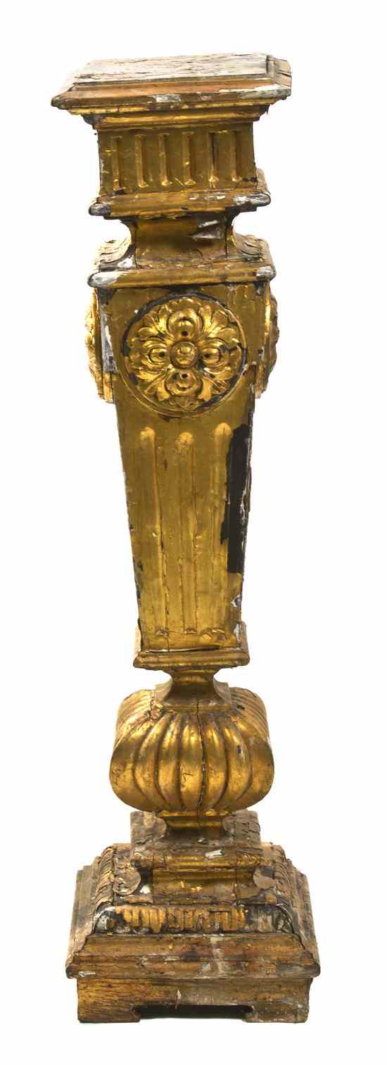 Appraisal: A Giltwood Pedestal of square baluster form with carved rosettes