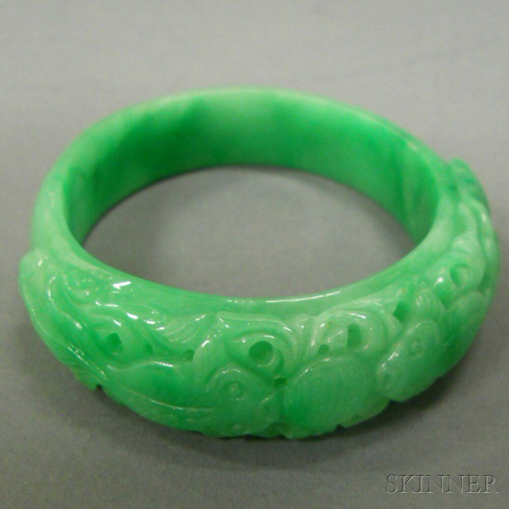 Appraisal: Green Stone Bangle China carved with a pair of confronting