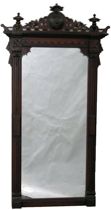 Appraisal: Victorian Wall Mirror Long mirror made from dark stained wood