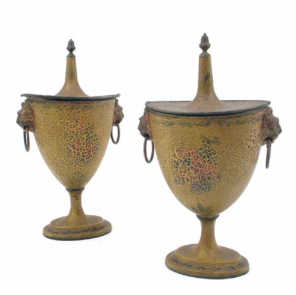 Appraisal: A pair of English painted tole and lead covered urns