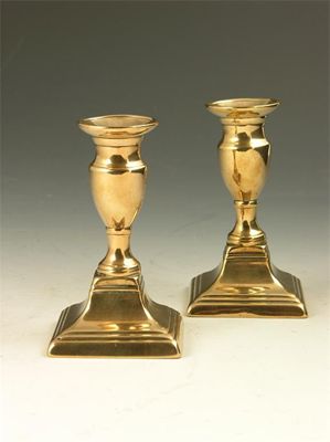 Appraisal: A pair of th century brass dwarf candlesticks raised on