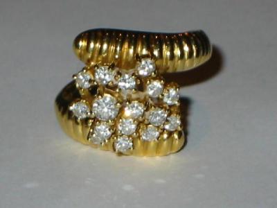 Appraisal: A DIAMOND COCKTAIL RING comprising sixteen brilliant cut diamonds set