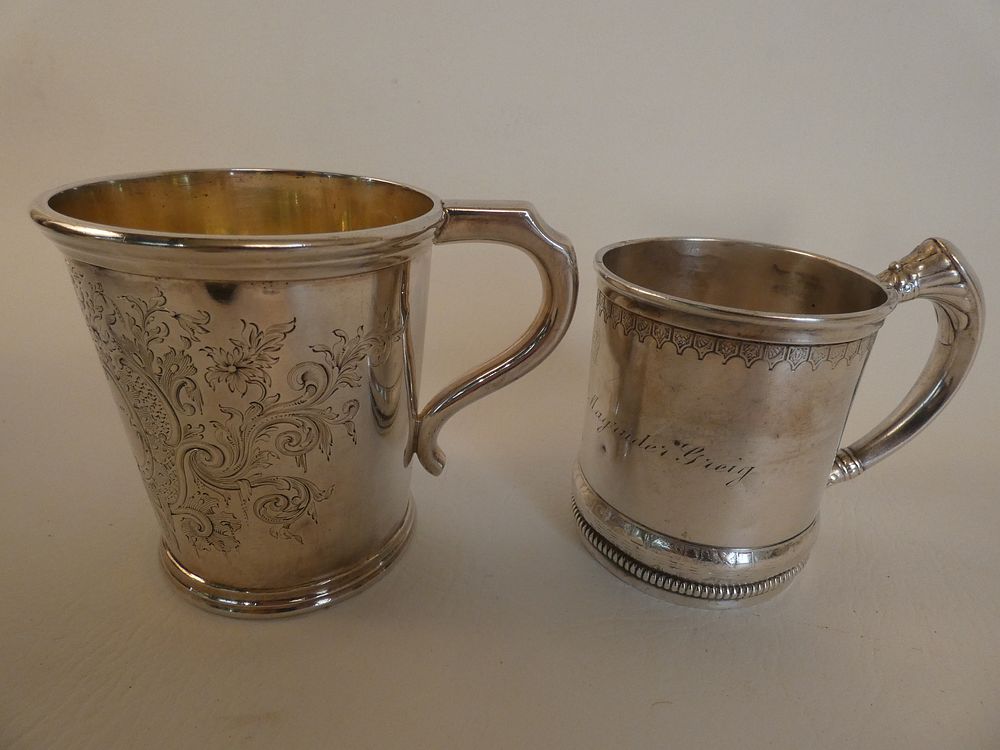 Appraisal: ANTIQUE SILVER CUPS Lot of antique engraved silver cups heavy