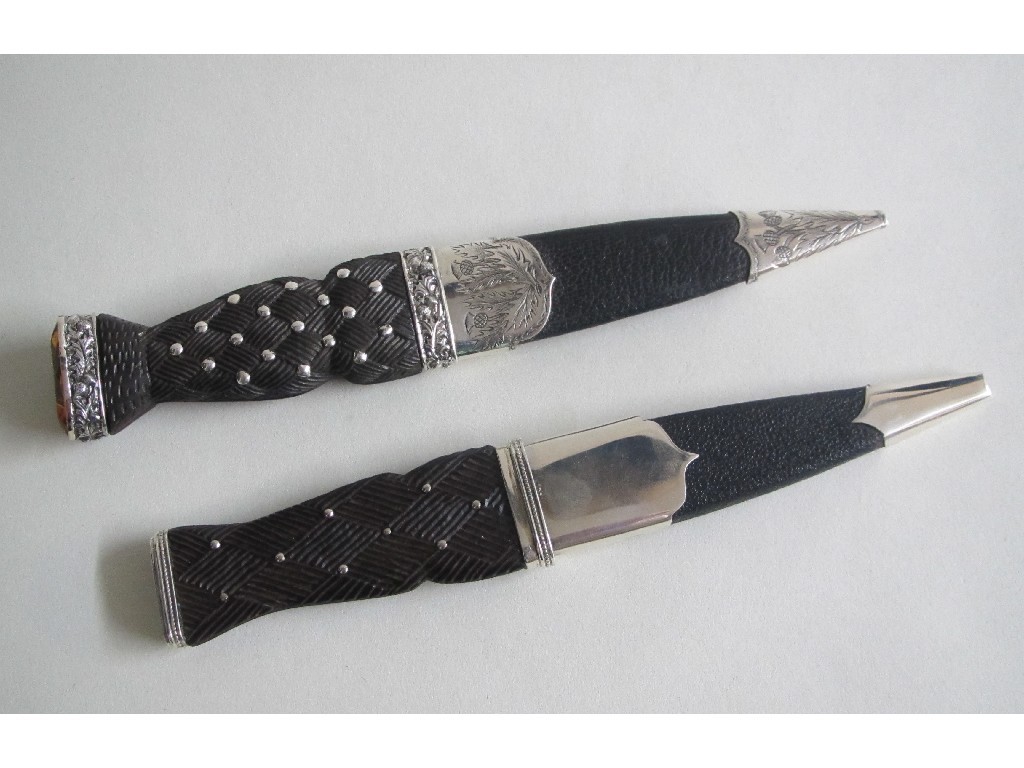 Appraisal: A silver mounted Skean Dhu with carved knot handle and