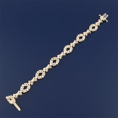 Appraisal: A Belle Epoque style diamond set bracelet Designed with swags