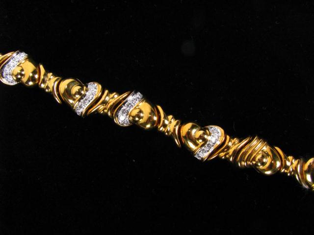 Appraisal: K Yellow Gold Heart Design bracelet accented with twenty-four round