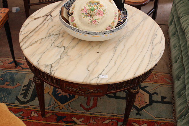 Appraisal: A FRENCH EMPIRE STYLE MARBLE TOPPED OCCASIONAL TABLE with applied