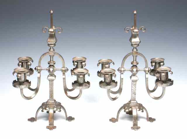 Appraisal: A PAIR OF VICTORIAN GOTHIC REVIVAL STEEL FOUR BRANCH CANDELABRA