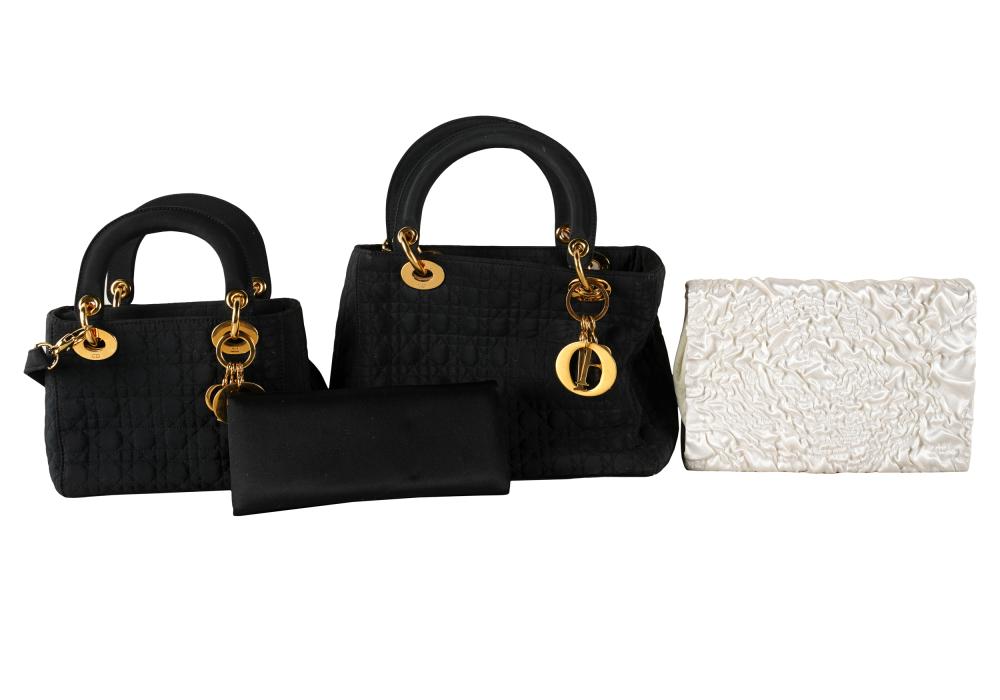 Appraisal: FOUR DESIGNER FABRIC HANDBAGScomprising two black Dior bags the larger