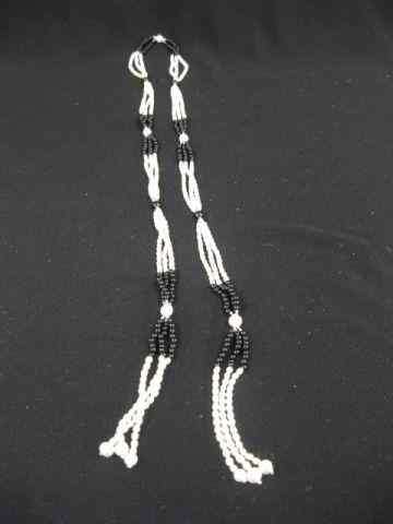 Appraisal: Pearl Onyx Necklace flapper style tassel ends wrap around style