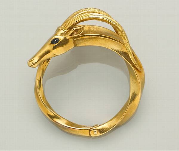 Appraisal: An eighteen karat gold gazelle motif bangle bracelet weighing approximately