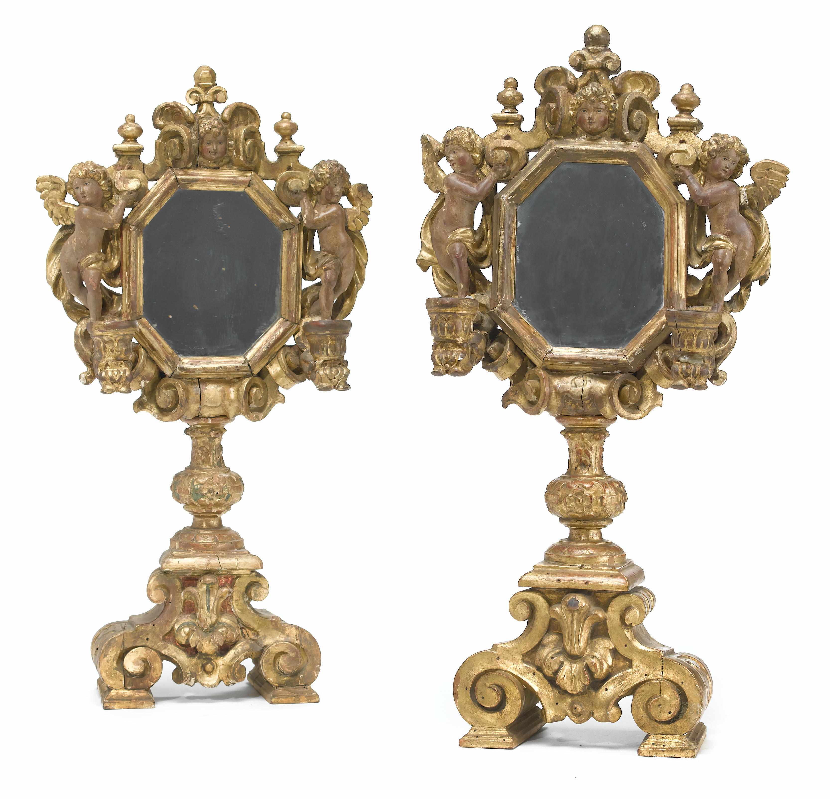 Appraisal: A pair of Italian Baroque style carved giltwood table mirrors