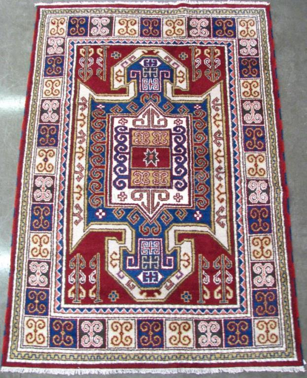 Appraisal: Handmade Oriental Area Rug Kazak design red field with cream