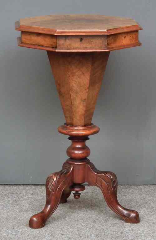 Appraisal: A Victorian walnut octagonal work table with fitted interior on