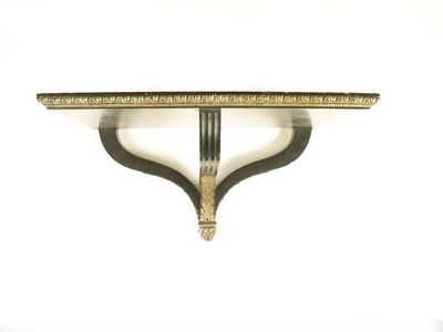 Appraisal: An ebonised and gilt brass mounted bracket the fluted supports