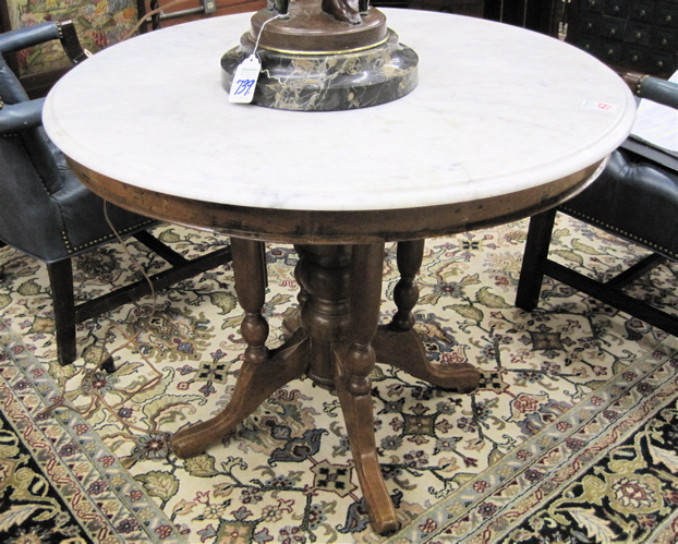 Appraisal: VICTORIAN STYLE MARBLE-TOP MAHOGANY CENTER TABLE having a round white