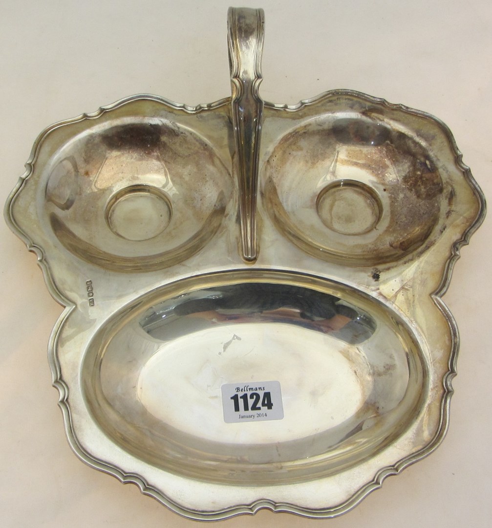 Appraisal: A silver dish of triple section form within a shaped