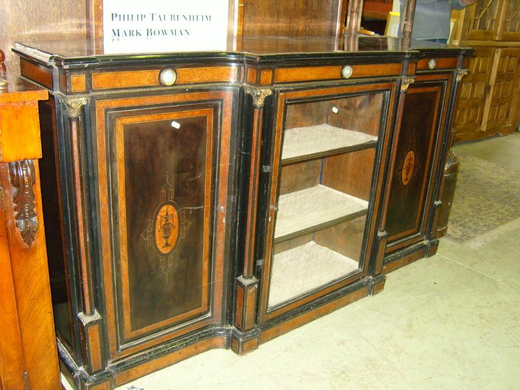 Appraisal: A Victorian ebonised breakfront credenza side cabinet enclosed by three