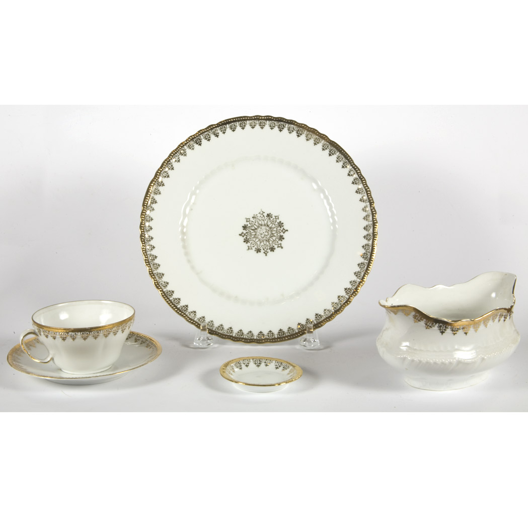 Appraisal: Continental Gilt Decorated Porcelain Dinner Service Approximately eighty pieces