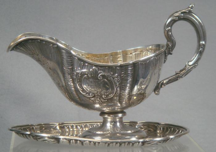 Appraisal: silver repousse gravy boat with attached underplate impressed Louis Werner