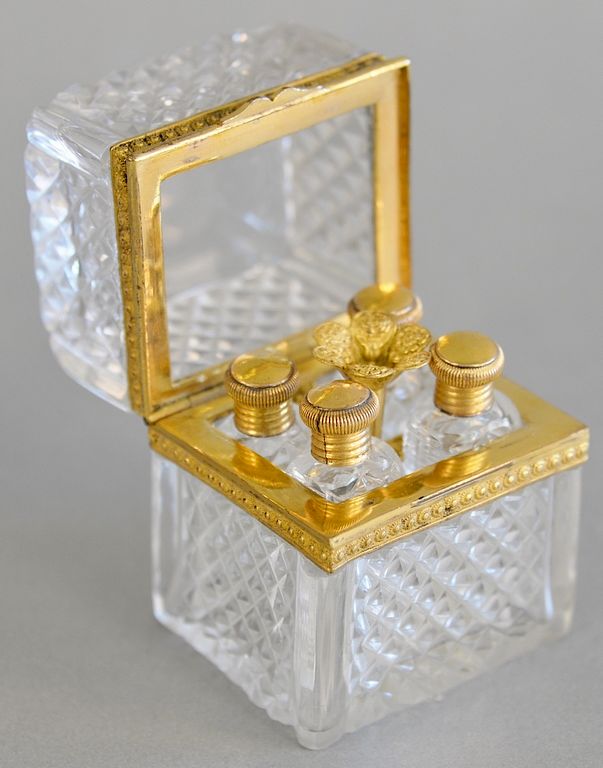 Appraisal: Crystal and gill metal case with four crystal perfumes with