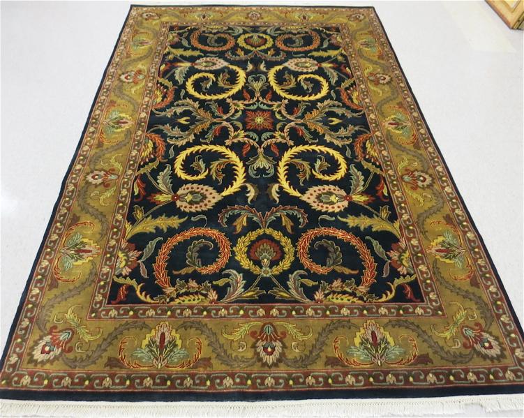 Appraisal: HAND KNOTTED ORIENTAL CARPET Indo-Persian colorful scrolling vine motif on