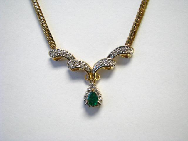 Appraisal: K yellow gold emerald and diamond pendant with approximately ct