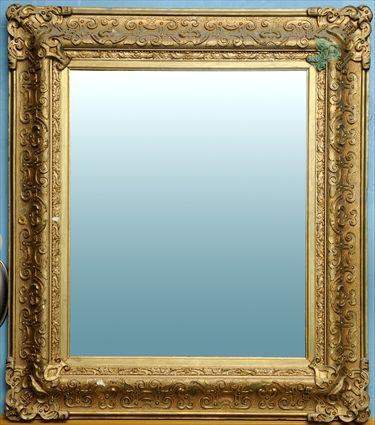 Appraisal: RENAISSANCE-STYLE GILTWOOD WALL MIRROR The rectangular mirror plate in conforming