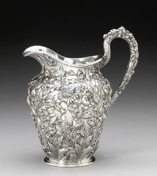 Appraisal: A sterling floral chased water pitcherS Kirk amp Son Co