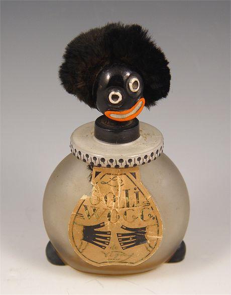 Appraisal: LE GOLLIWOGG FRENCH PERFUME BOTTLE De Vigny Paris satin glass