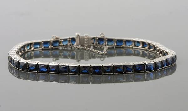 Appraisal: An art deco sapphire and platinum line bracelet with gold