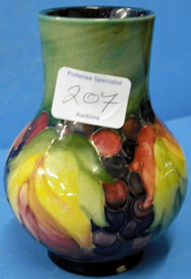 Appraisal: Moorcroft Vase decorated in Leaf Berry design on green ground