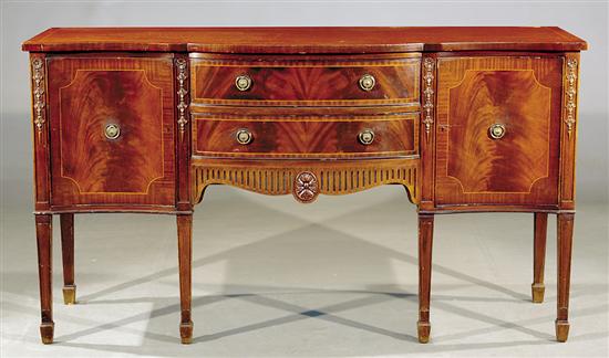 Appraisal: Georgian style inlaid mahogany serpentine sideboard shaped top over conforming