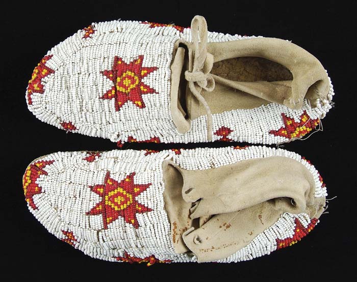 Appraisal: PLAINS INDIANS BEAD DECORATED MOCCASINS Fully decorated with a geometric