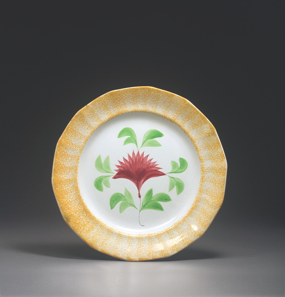 Appraisal: RARE STAFFORDSHIRE YELLOW SPATTERWARE 'COCKSCOMB' PATTERN PLATE CIRCA Painted in