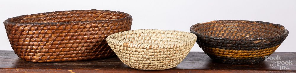 Appraisal: Three Pennsylvania rye straw baskets th c Three Pennsylvania rye