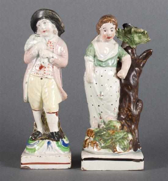 Appraisal: Two Staffordshire pearlware figures of children late th century girl