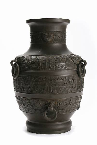 Appraisal: A Chinese bronze ovoid form vase with ring handles height