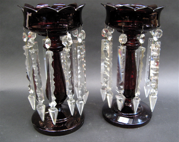 Appraisal: PAIR RUBY-RED GLASS LUSTRES having elongated clear hanging faceted prisms