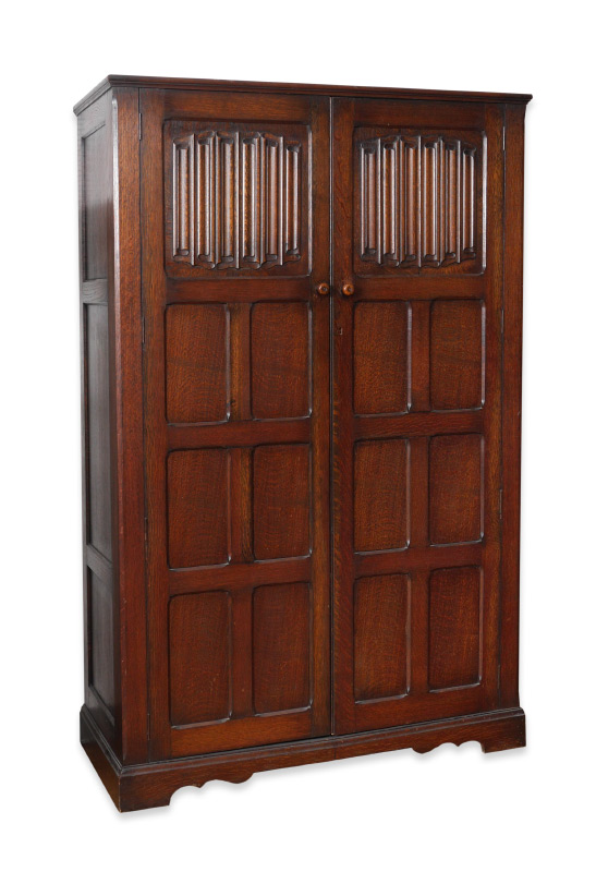 Appraisal: CARVED OAK LINEN FOLD ARMOIRE paneled doors top panel on