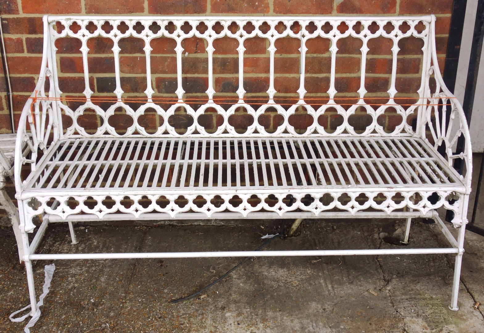 Appraisal: A white painted iron framed garden bench of Gothic Revival