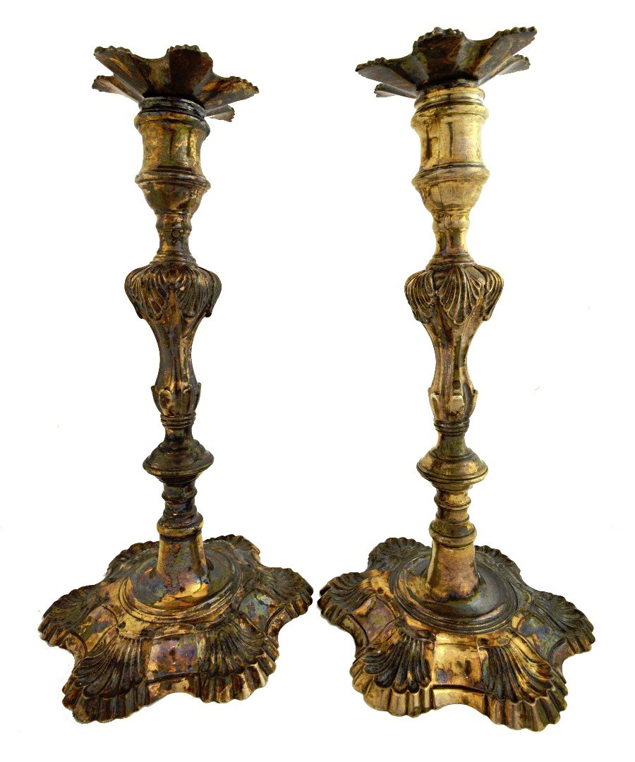 Appraisal: A pair of silver table candlesticks each of cast form