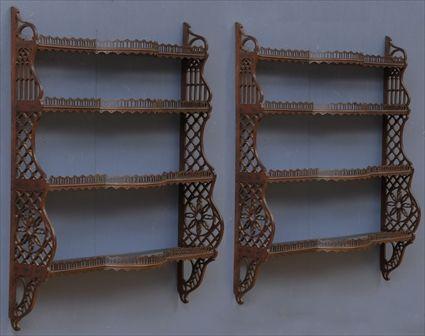 Appraisal: PAIR OF CHIPPENDALE-STYLE CARVED MAHOGANY HANGING SHELVES Each with galleried